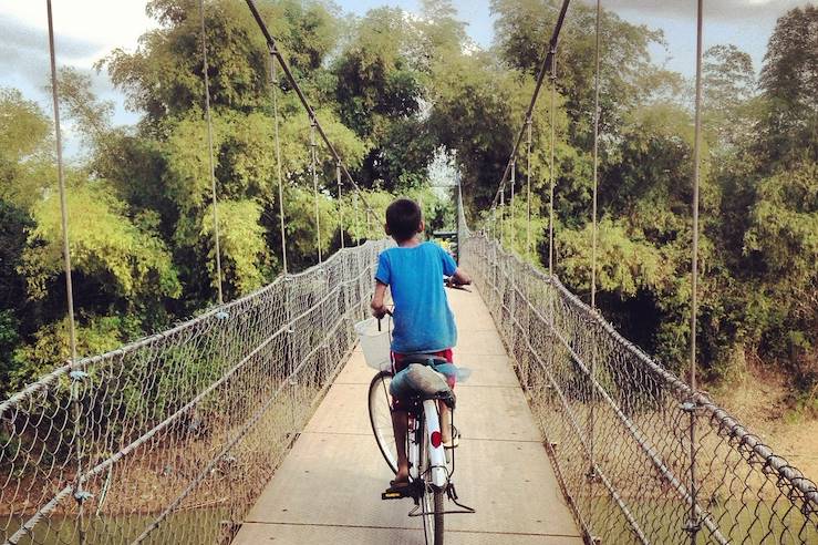 Young man riding a bike - Cambodia © turleyt/stock.adobe.com