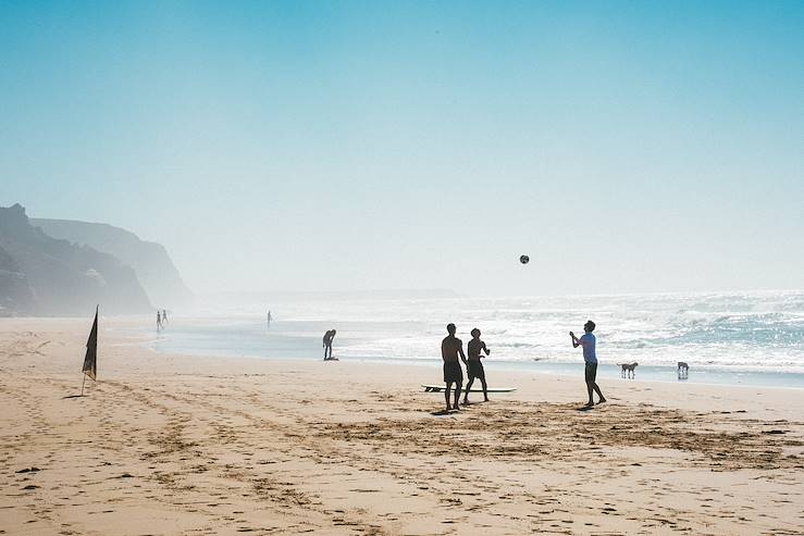 Men playing on the beach - Portugal © Casa Mae